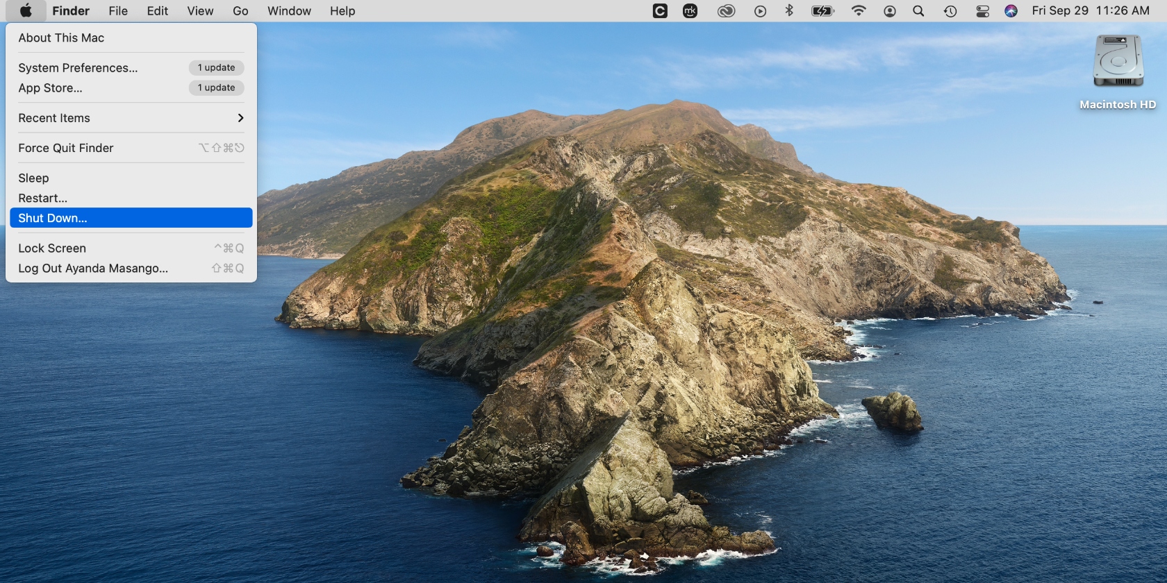 Shutting down a Mac device via the Apple menu.